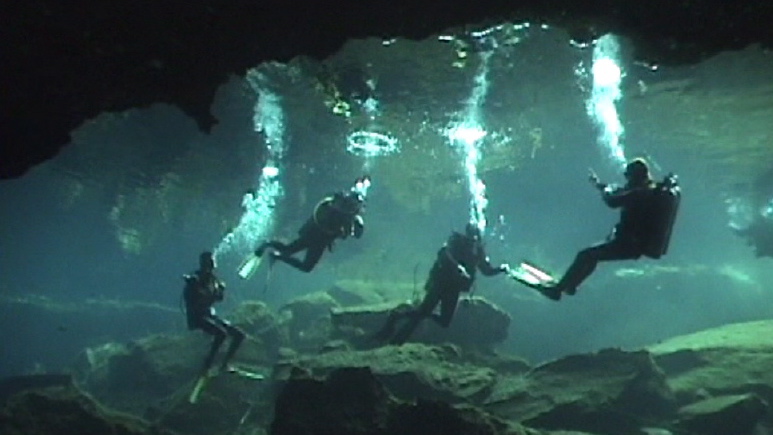 Divers in Cenote Chac Mool